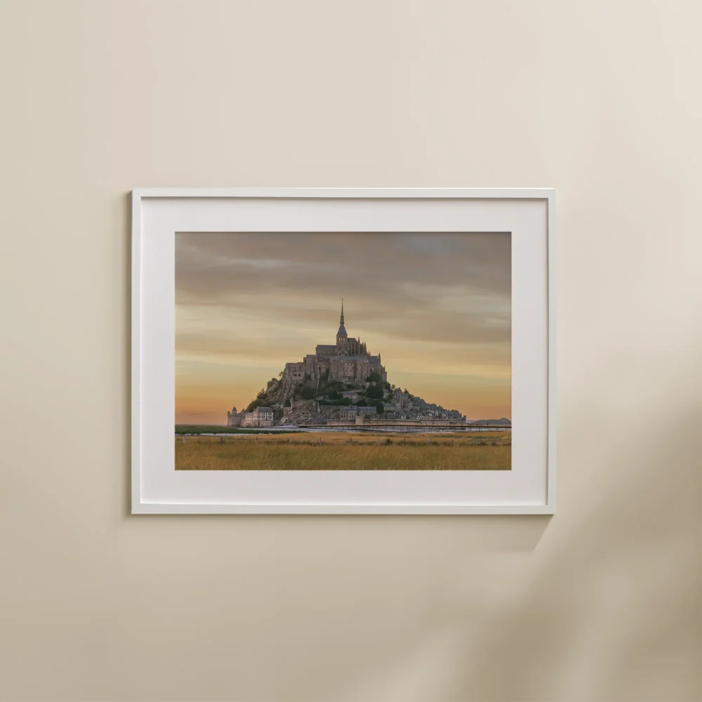 Mont Saint Michel Sunset print depicting the ancient abbey, set against a pastel sky at sunset