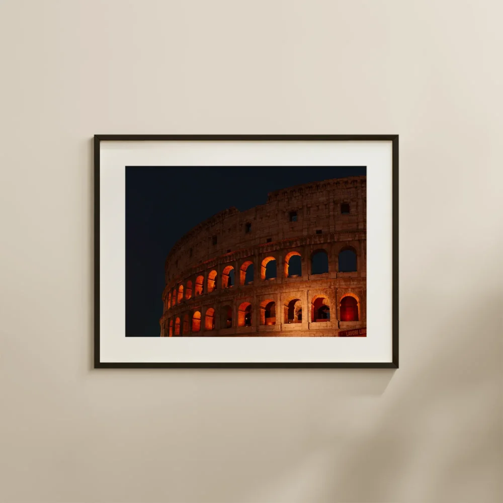 Colosseum at Night print depicting the famous Roman landmark set against the night sky, bathed in golden light
